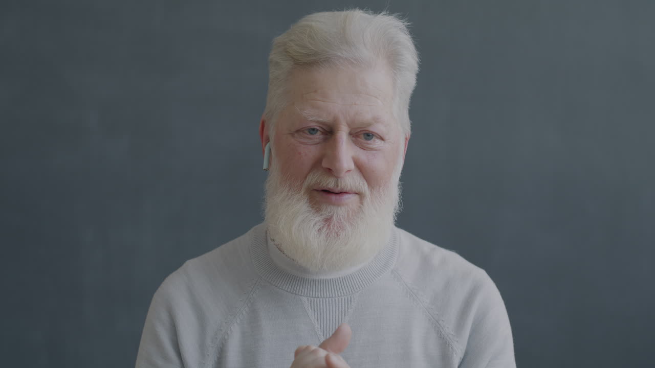 Senior Man with Earbuds