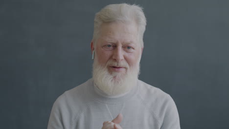 senior man with earbuds
