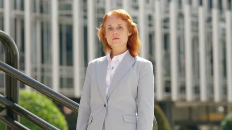 confident businesswoman standing outdoors