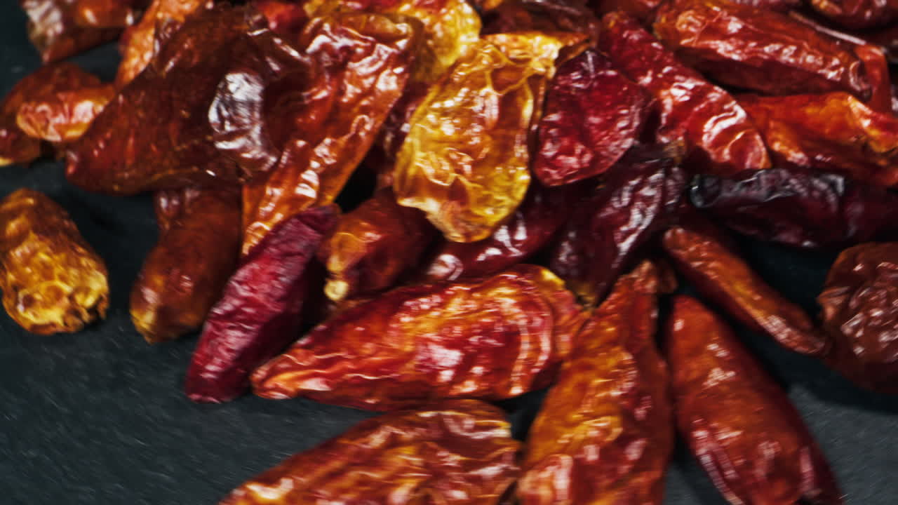 Dried red hot spicy chilli pepper rotating close-up macro. Spice for food. Dried vegetable.High quality 4k footage