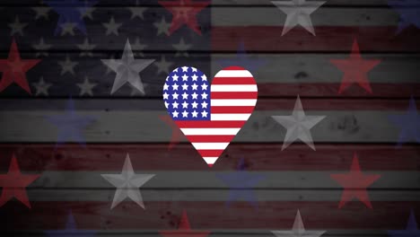 Animation-of-heart-coloured-with-american-flag-on-wooden-background