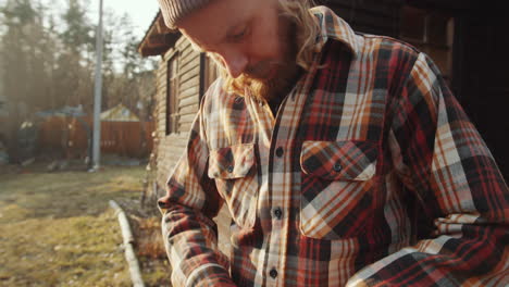 man sharpening knife for cooking bbq outdoors