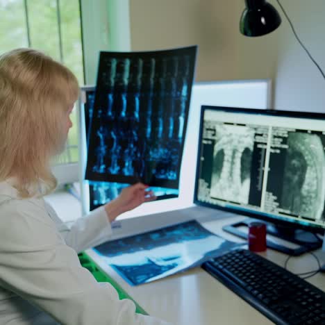 female doctor holding x-ray