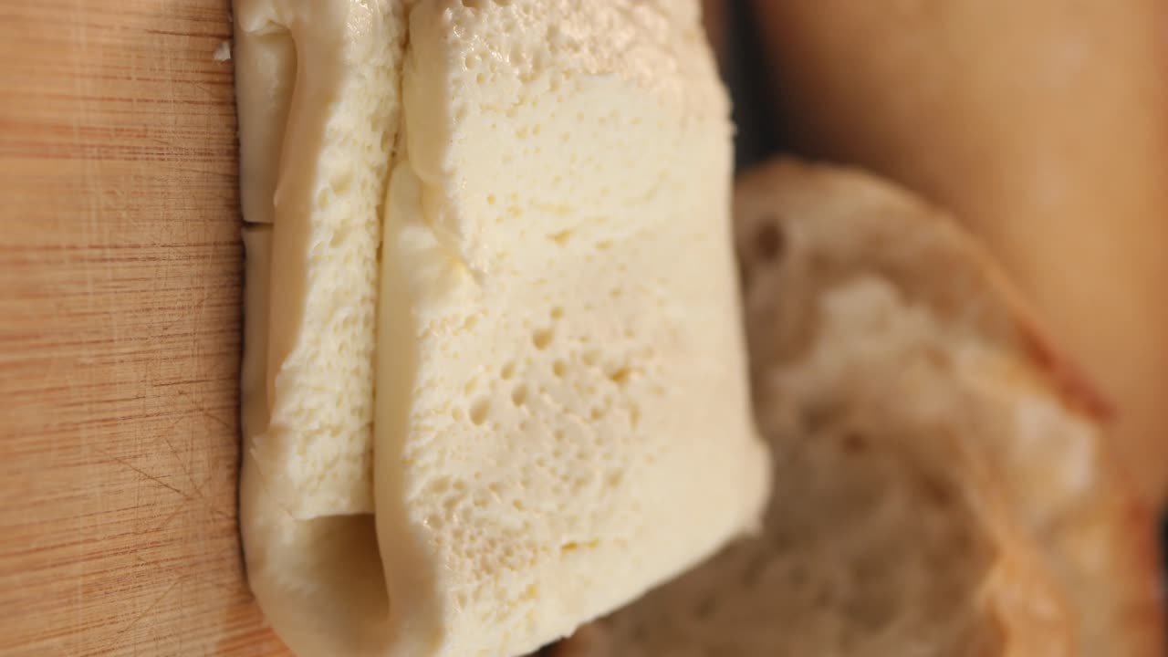 Cheese and Bread on Wooden Board