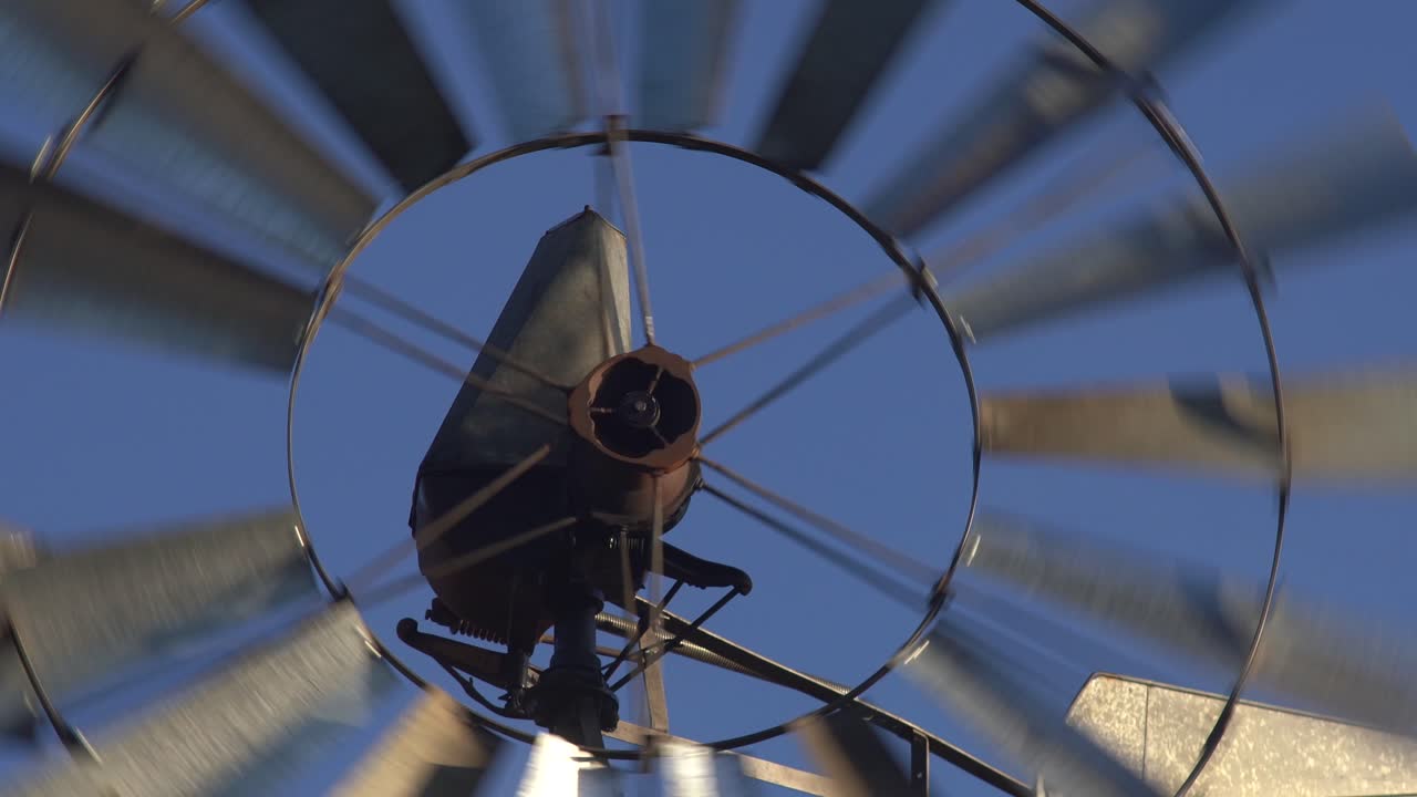 Detail of a old windmill turning with the wind on a bright blue sky in Patagonia, Argentina