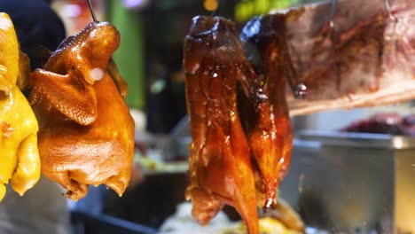 roast chickens hanging in a hong kong market