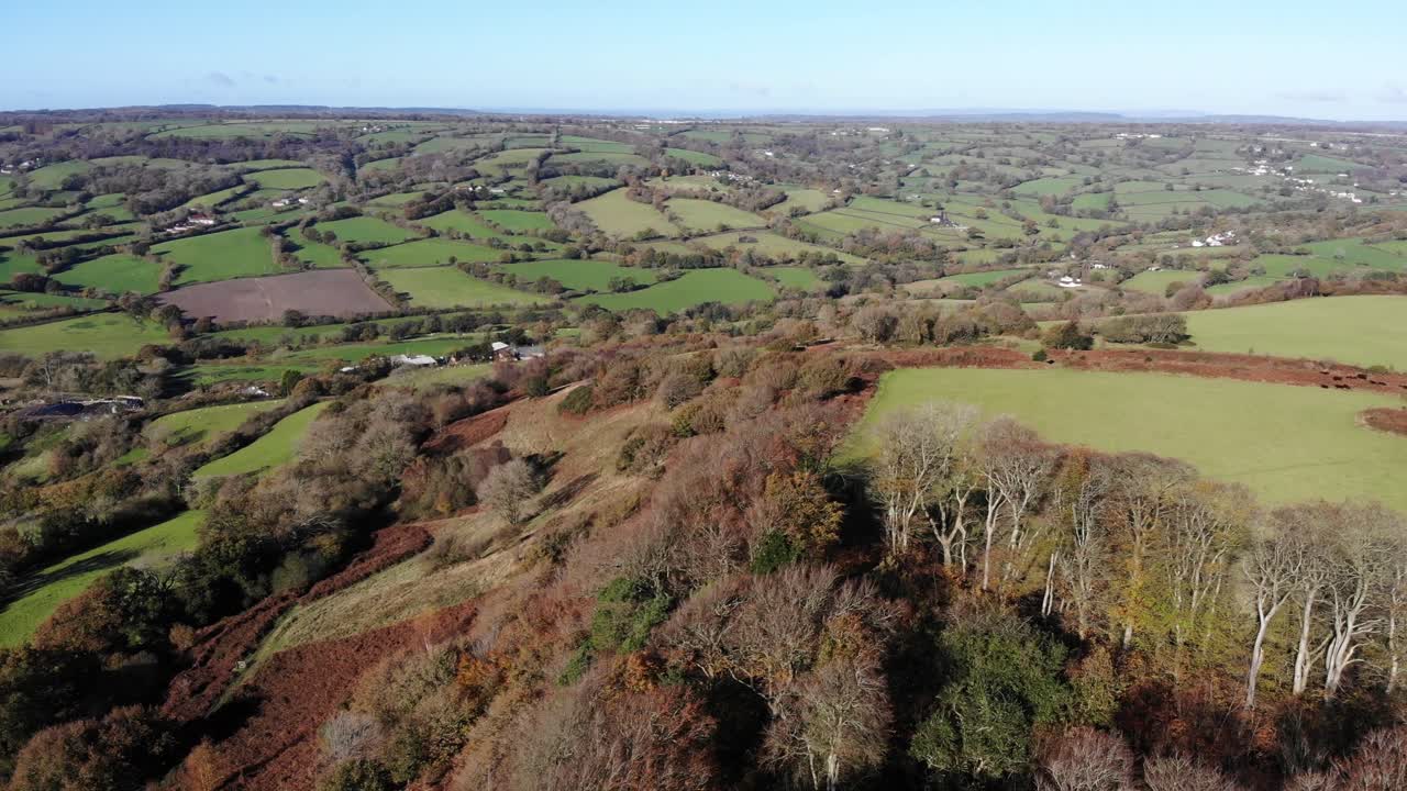 Aerial left panning view of the East Devon and English Countryside from Dumpdon Hill on a sunny day