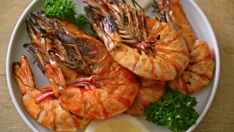 grilled tiger shrimp on white plate