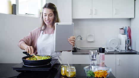 woman talking on video call with tablet