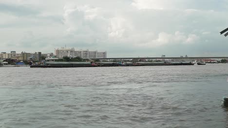 Long-transportation-boat-in-the-Chao-Phraya-river-in-Bangkok,-Thailand