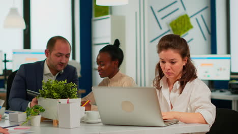 Focused-woman-manager-typing-on-laptop,-browsing-on-internet