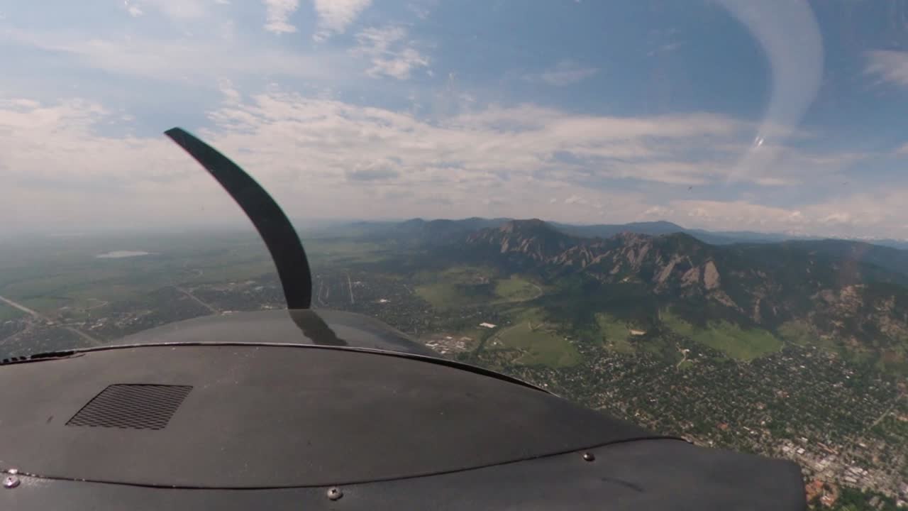 1969 Cessna 182N flies along the front range in Colorado