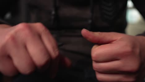 man cleaning his fingernails with an instrument, healthcare, manicure, close up