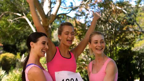 young female athletes cheering after victory