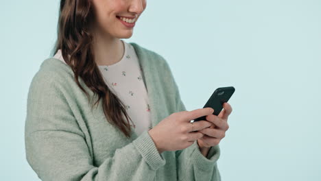 Woman,-hands-and-typing-with-phone-in-studio