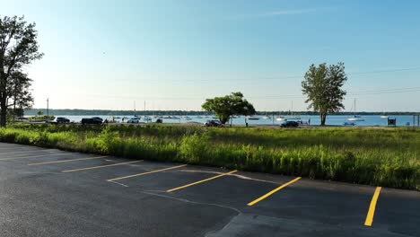 sailboats off the coast near a marina build site