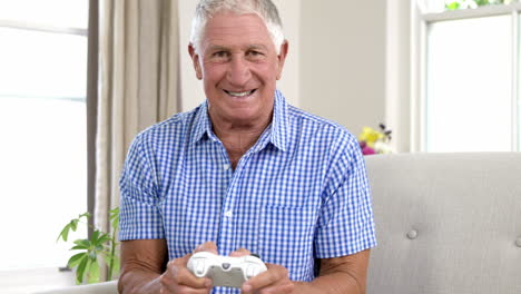 smiling old man playing video game
