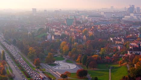 warsaw poland on misty autumn morning, aerial view of busy traffic, old town, st. john the baptist cathedral and multimedia fountain park