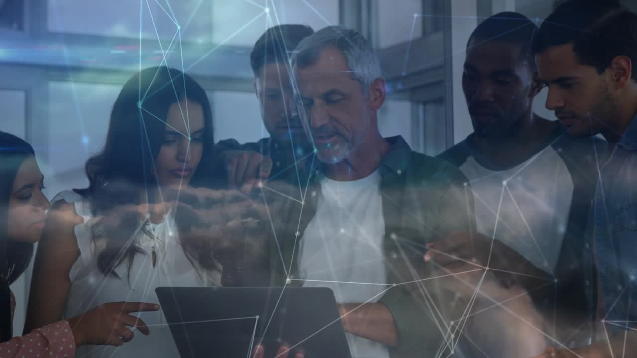 Lead tapping tablet guiding team reviewing business data, cloud overlay drifting over group