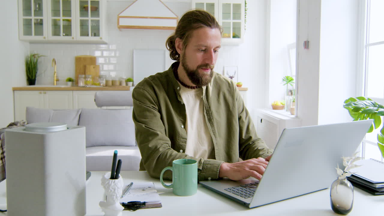 Man sitting at desk in the living room