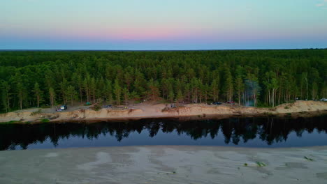 Camping-spot-location-near-forest-and-Baltic-Sea-coast,-aerial-Latvia-nature