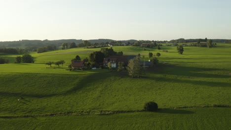 aerial establishing shot of small hamlet of houses in europe using solar power