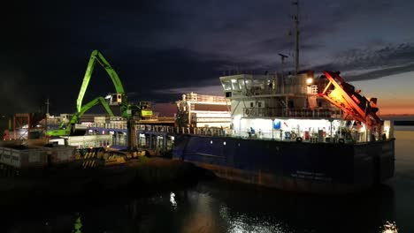 A-video-capturing-the-enchanting-reflection-of-the-dancing-lights-of-the-ships-waiting-in-the-harbor-on-the-sea-surface