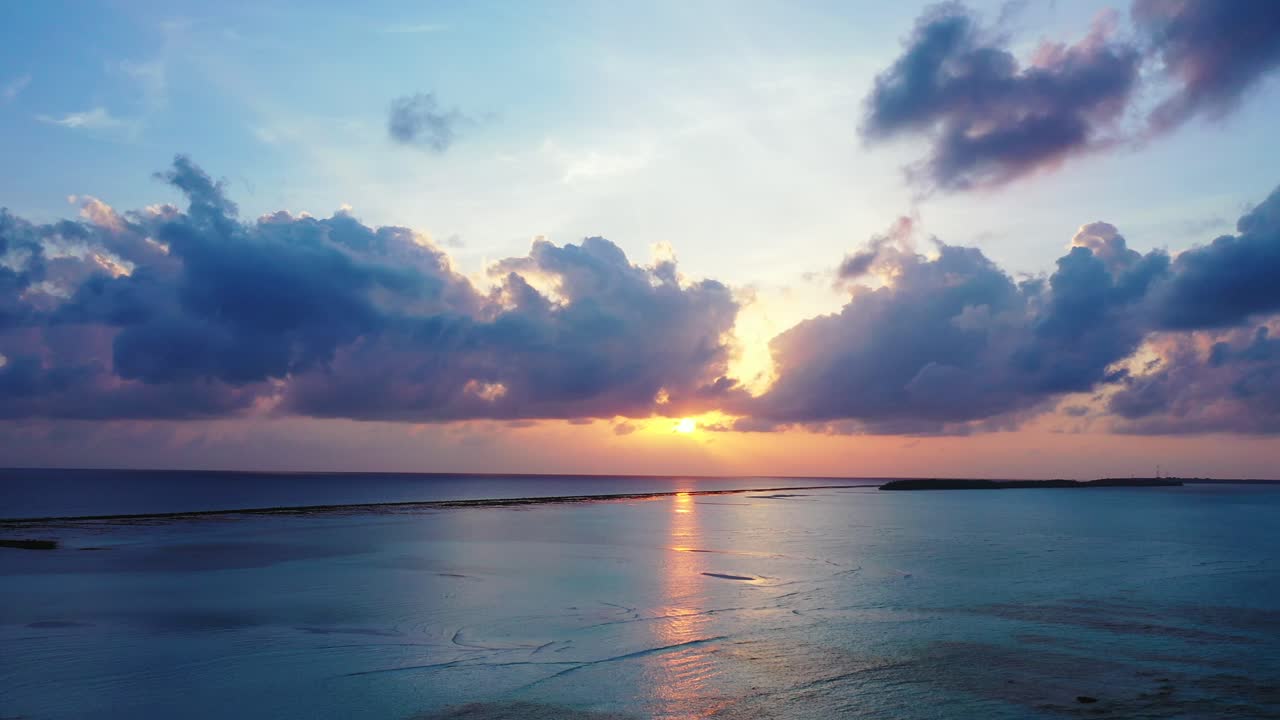 Bora bora sunset. Beautiful golden sun ray coming through the heavy dark clouds over the calm open ocean