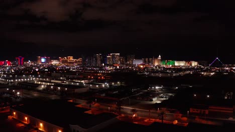 aerial wide dolly shot of the central and south areas of the las vegas strip at night