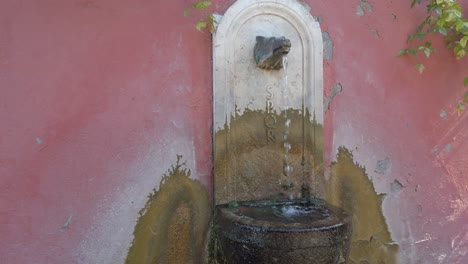 Slow-motion-of-a-typical-roman-fountain-located-in-the-Rome-Rose-Garden