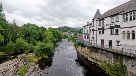 river flowing through town with historic buildings