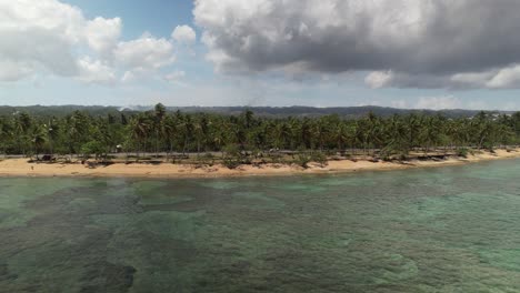 Aerial-Slide-Tracking-View-of-a-Car-in-Coastline-Road,-Dominican-Republic