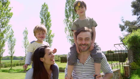 Parents-Give-Sons-Ride-On-Shoulders-During-Walk-Shot-On-R3D