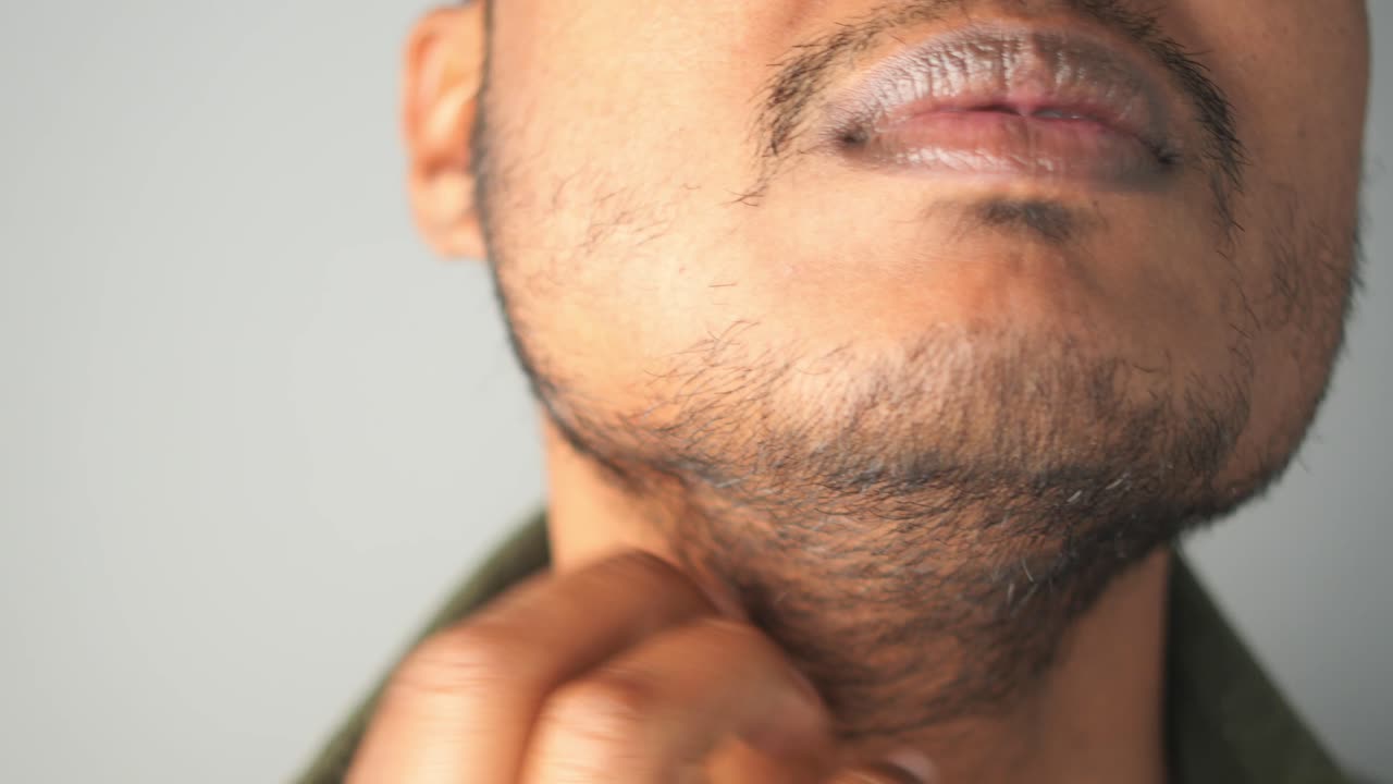 Close-up of a man's face and neck