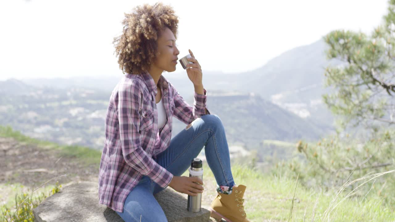 Side view of tourist drinking on rest