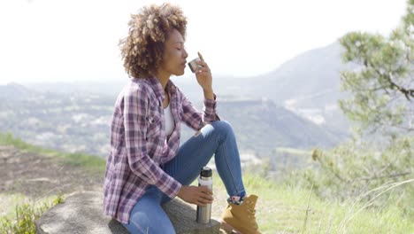 Side-view-of-tourist-drinking-on-rest