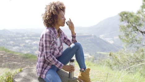 side view of tourist drinking on rest