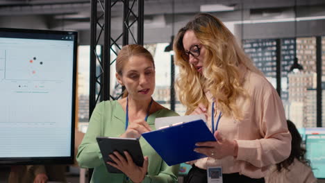 vertical video ambitious group of multiethnic women collaborating in a modern office
