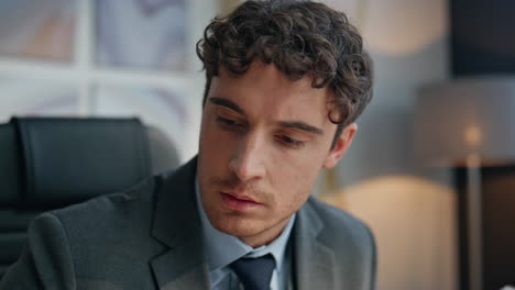 Serious executive looking solution at workplace portrait.Businessman thinking