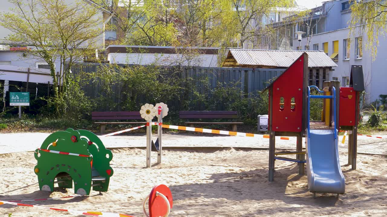 Children's playground closed with barrier tape during covid 19 pandemic