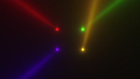 Colorful-glowing-spotlight-beams-on-black-gradient-stage