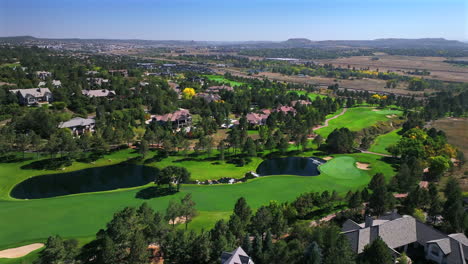castle pines village north ridge golf course spring summer aerial drone denver colorado front range sunrise morning i25 highlands ranch park meadows daniels park neighborhood homes forward pan up