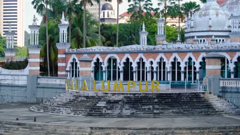 kuala lumpur mosque and city skyline