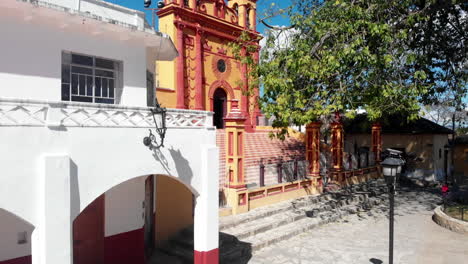 Drone-take-off-Comitan-de-Dominguez-Chiapas-Reveal-town-blue-cloud-sky