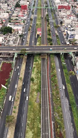 aerial view of city highway and train tracks