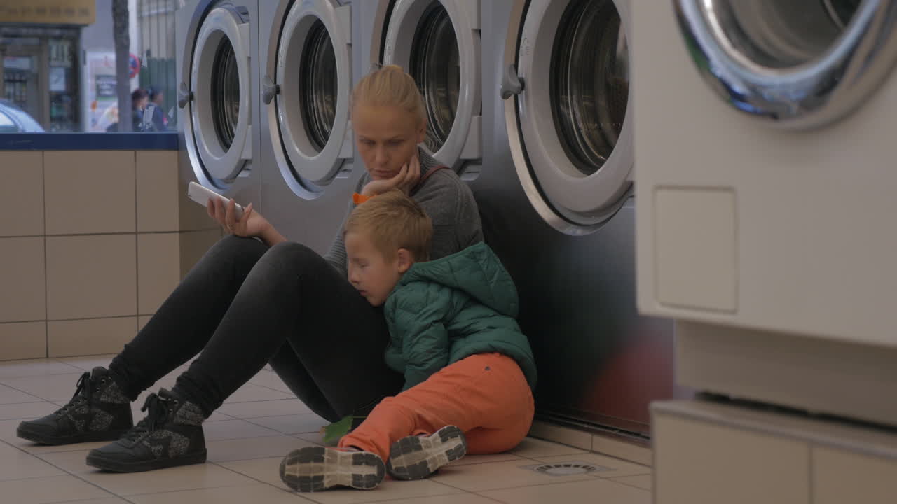 Mother and child in the laundry