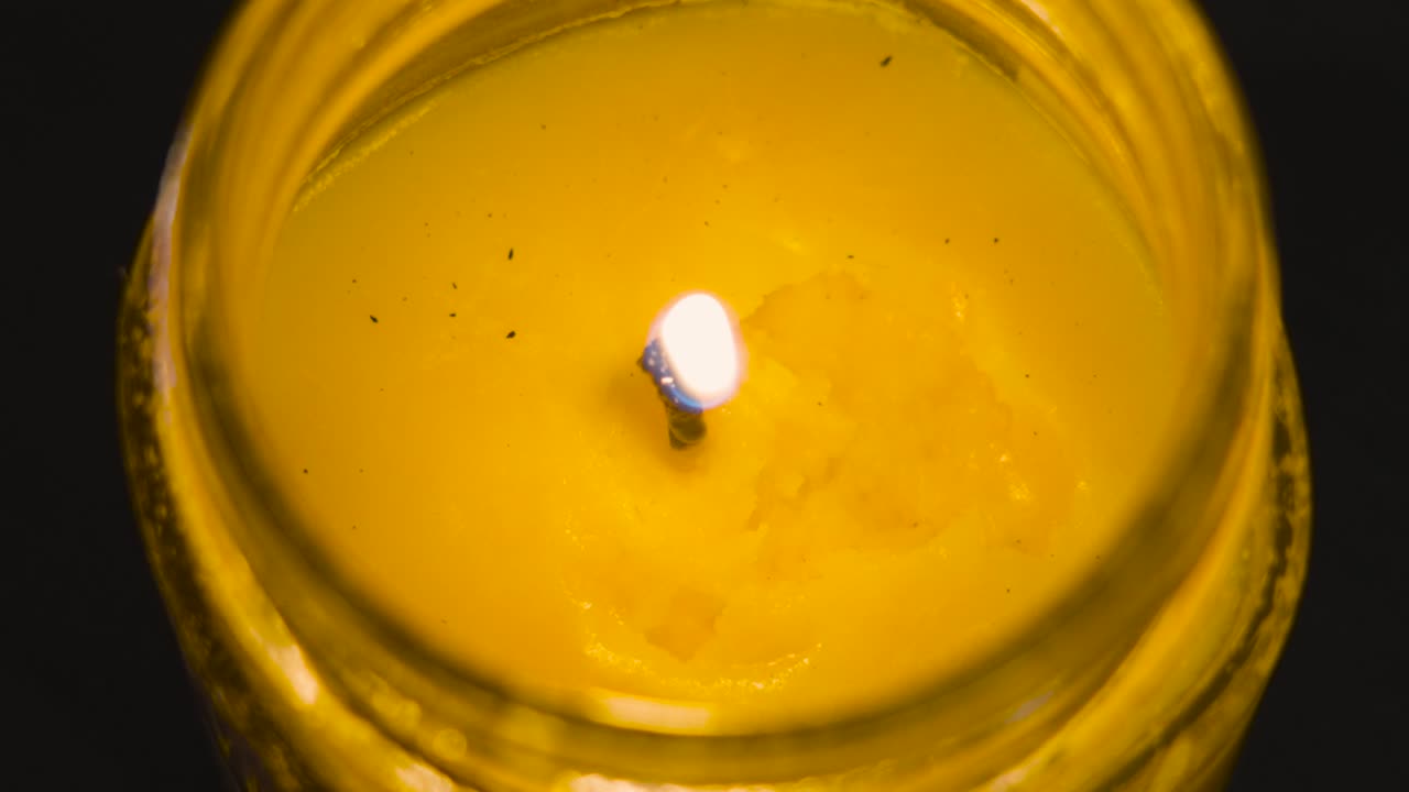 Close up slow motion look at a pop in the wick