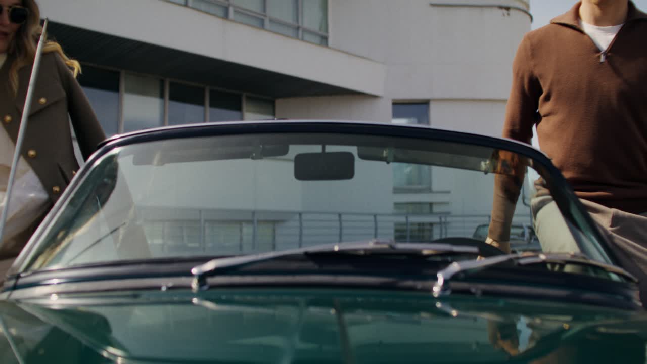 Couple in a Vintage Convertible Car