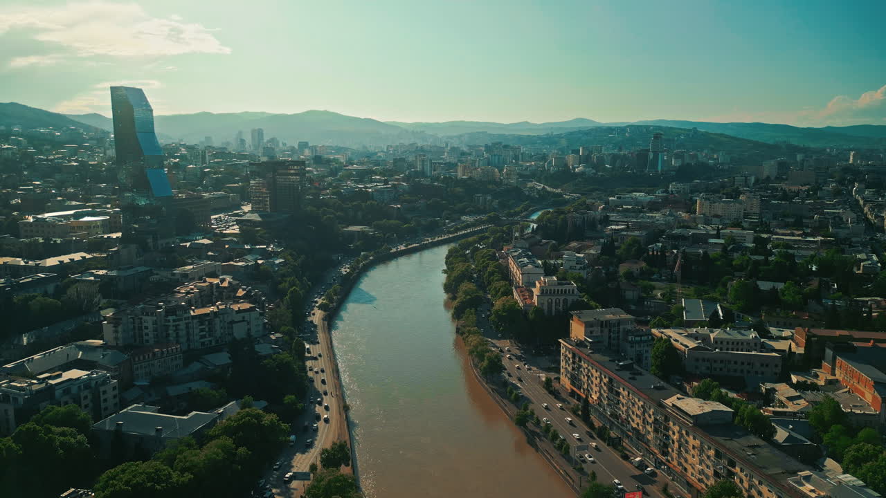 Aerial view of Tbilisi cityscape with the Kura River and modern architecture
