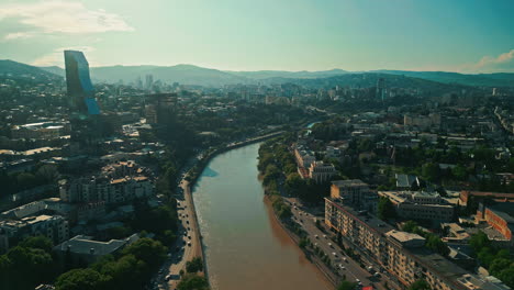 aerial view of tbilisi cityscape with the kura river and modern architecture
